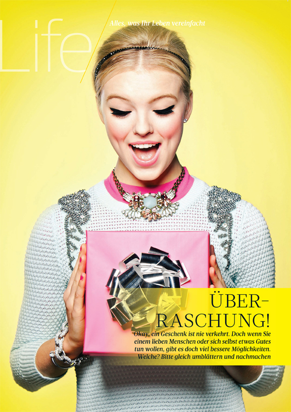 Girl holding a box with a bow in Women's Health Germany