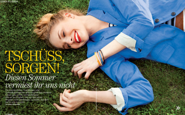 girl laying in grass laughing
