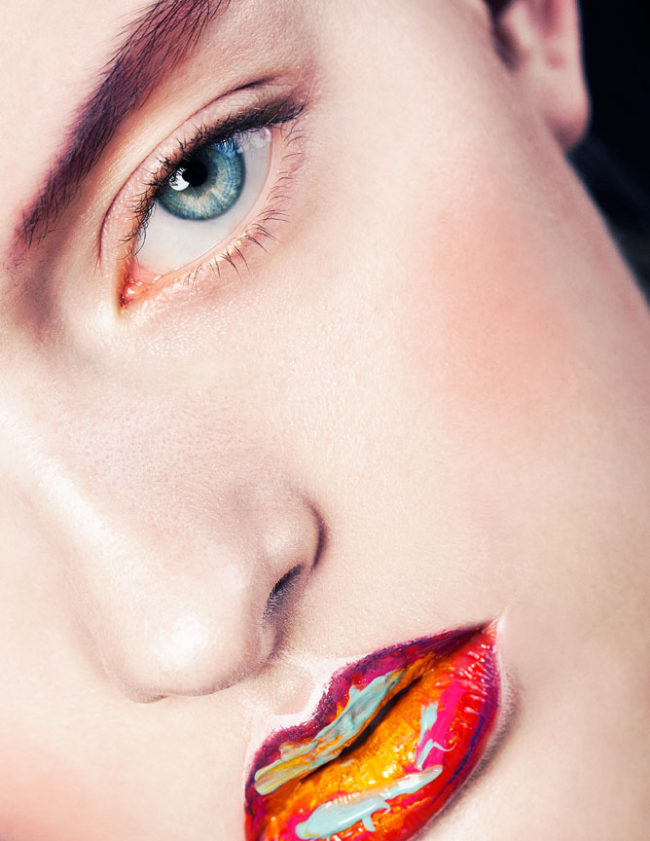 Colorful macro beauty with a focus on multicolored lipstick